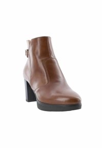 Stivale alla caviglia in pelle marrone con design affusolato, tacco alto a blocco, dettaglio fibbia laterale e texture liscia.