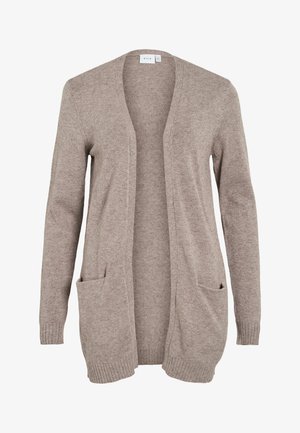 Dlouhý béžový svetr s otevřeným předním dílem, texturovaná pletenina, dvě přední kapsy a žebrované manžety. Není přítomno žádné zapínání ani ozdoby.