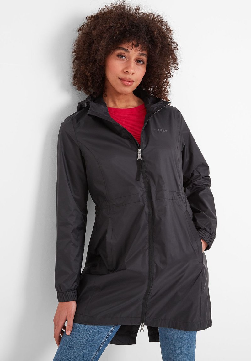 Black waterproof jacket with a zip front, adjustable hood, elastic cuffs, and side pockets, paired with a red shirt and blue jeans.