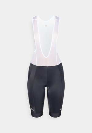 Breteles de ciclismo pretos com parte superior em malha branca de corte baixo, apresentando uma textura respirável e detalhe de logotipo na bainha.