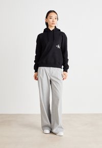 Calvin Klein Jeans OFF PLACED MONOLOGO HOODIE  - Felpa - black
