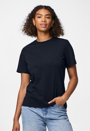 Navy blue cotton t-shirt with short sleeves, crew neckline, and a relaxed fit, paired with light blue jeans, presented against a white background.