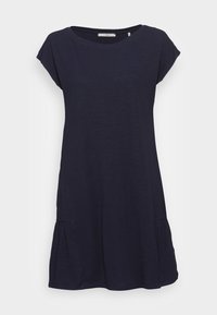 Laivastonsininen lyhythihainen mekko, joka on valmistettu kevyestä kankaasta ja siinä on rento istuvuus. Mekossa on sivupleatsit ja pyöreä pääntie.