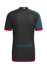 Zwart sportshirt met rode rand, met een meshstructuur en blauw Herbalife-logo op de achterkant. Voorzien van een contrasterend ontwerp van de schouderpanelen.