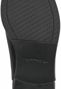 Svart gummi skosula med ett strukturerat mönster, med en slät yta och ett stämplat varumärkeslogotyp. Storlek angiven som 37.