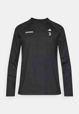 Long-sleeve black shirt made of soft fabric, featuring white logo accents and text on the front. Seamless neck and raglan sleeves.