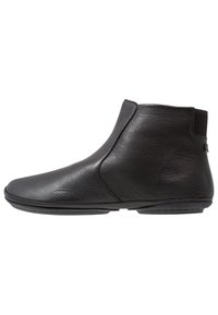 Black leather ankle boots with a smooth texture, rounded toe, and elastic side panel. Low-profile sole for flexible movement.