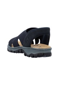 Sandale noire avec tige respirante, semelle intérieure rembourrée et semelle extérieure texturée. Dispose de deux larges brides pour le soutien et d'une semelle anatomique.