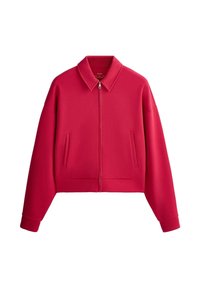 Veste rouge zippée avec col pointu, manches longues, deux poches latérales et poignets côtelés, présentée sur fond blanc.