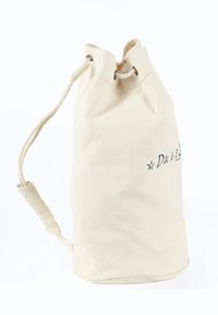 Sac din bumbac cu șnur de culoare crem, cu o bază rotundă. Dispune de un vârf strângător și o mânere lateral. Are text imprimat pe o parte.