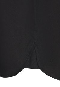 Black garment fabric showing a textured finish with a curved hemline and visible stitching details. The material appears lightweight and flexible.
