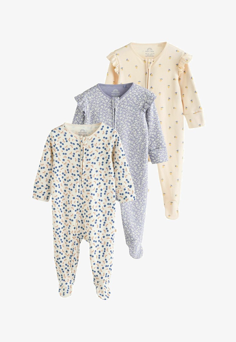 Trois grenouillères bébé à manches longues avec pieds en blanc, lavande et crème, chacune avec différents petits motifs floraux ou fruités et des détails à volants.