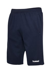 Marineblaue Freizeithose mit elastischem Bund, Seitentaschen und weißem "hummel"-Logo am unteren rechten Bein.