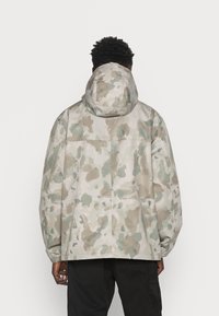 Carhartt WIP Lehká bunda - beige
