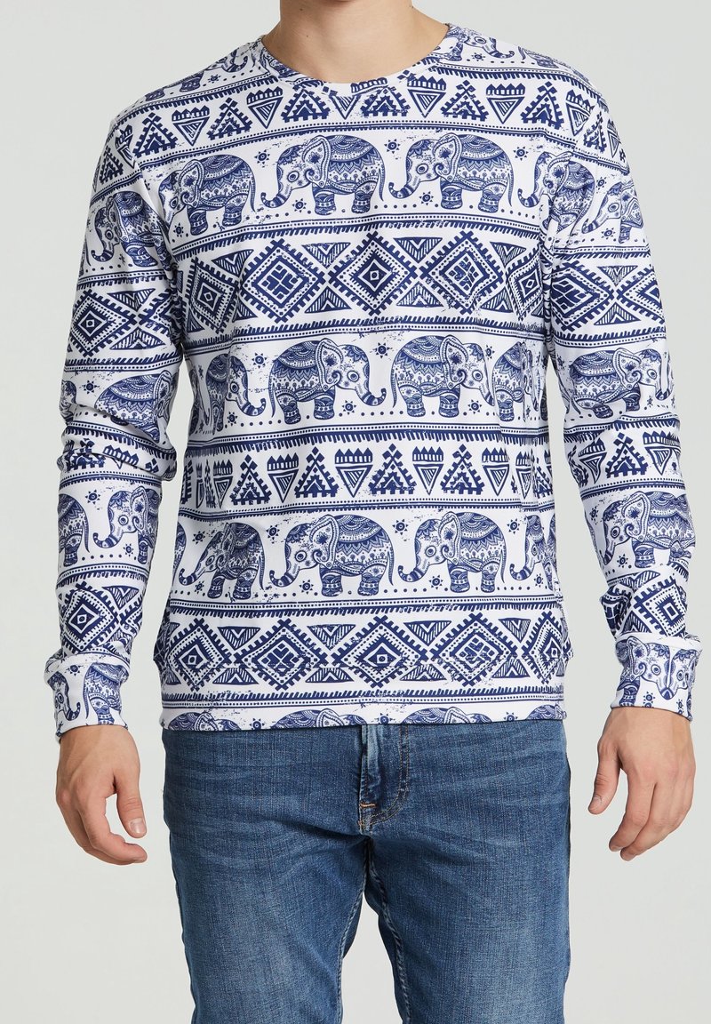 Lange mouw T-shirt met een witte achtergrond, een blauwe olifant en een geometrisch patroon, gemaakt van een lichtgewicht, zachte stof.