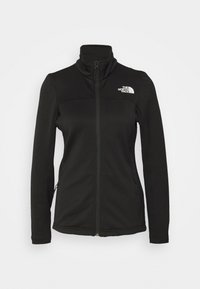 Czarna polarowa kurtka z wysokim kołnierzem, pełnym zamkiem błyskawicznym i dwiema bocznymi kieszeniami. Zawiera logo The North Face w górnej lewej części klatki piersiowej.