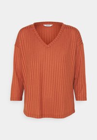 Pull en V couleur rouille en fabric côtelé avec des manches trois-quarts et une coupe décontractée. Possède de subtiles rayures verticales et une texture douce.