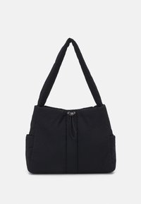 Sac fourre-tout noir matelassé avec deux poignées épaisses, une fermeture à cordon de serrage et des poches latérales. Forme rectangulaire simple avec un tissu texturé.