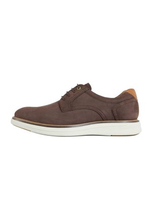 Brown leather casual lace-up shoe with white sole and tan heel accent, shown in side view on white background.