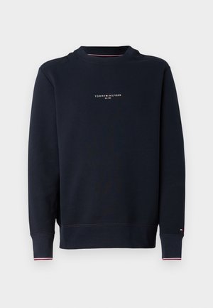 Navyblauwe Tommy Hilfiger trui met lange mouwen, kleine logotekst op de borst en geribde boorden met rode en witte bies.