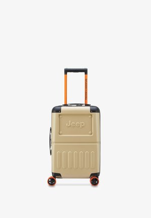 Valigia rigida beige con dettagli neri, manico retrattile arancione e quattro ruote. Presenta il logo "Jeep" e un design con scanalature visibili.