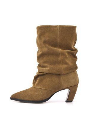 Brown suede mid-calf slouch boot with pointed toe and angled block heel on a white background.