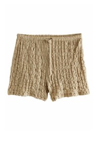 Shorts texturés beige avec un design froissé et une taille élastique, dotés d'un cordon de serrage pour l'ajustement.