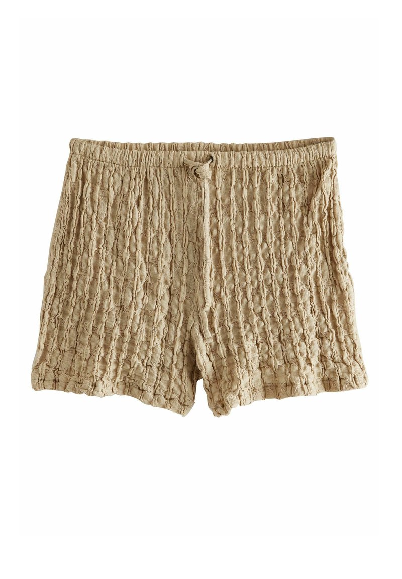 Shorts texturés beige avec un design froissé et une taille élastique, dotés d'un cordon de serrage pour l'ajustement.