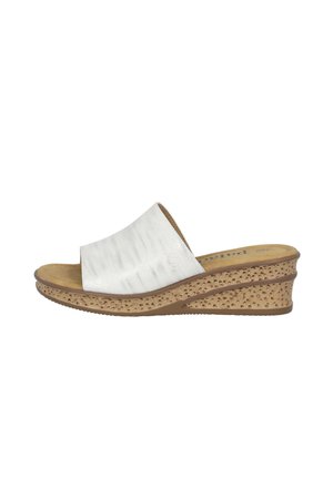 White slide sandal with a textured upper, cushioned footbed, and a cork-wrapped wedge sole with a patterned surface.