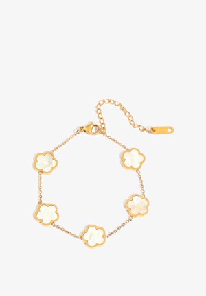 Gold bracelet with five white mother-of-pearl flower-shaped charms linked by delicate chains and a lobster clasp closure with extender chain.