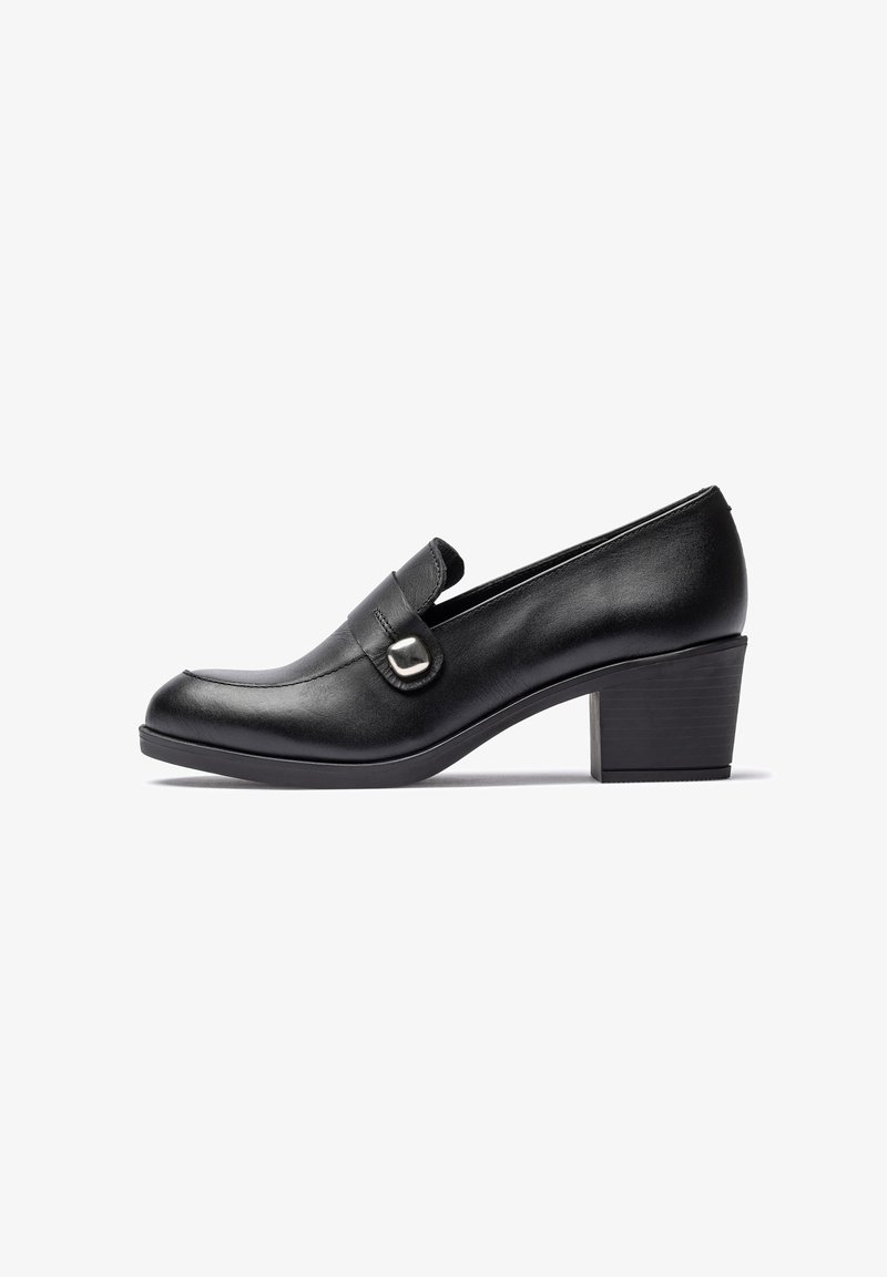 Black leather low block heel loafer with decorative silver buckle and rounded toe, shown in side profile on white background.