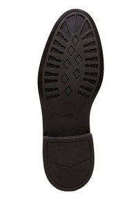 Semelle en caoutchouc noir avec un motif texturé comportant des motifs en losange et linéaires. Talon plat et arrondi avec une finition lisse et une zone de marque.