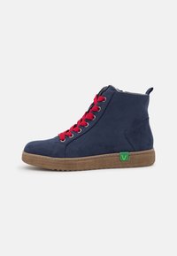 Navy suede high-top sneakers with red laces, featuring a textured sole and green logo accent on the side. Zipper closure on the inside.