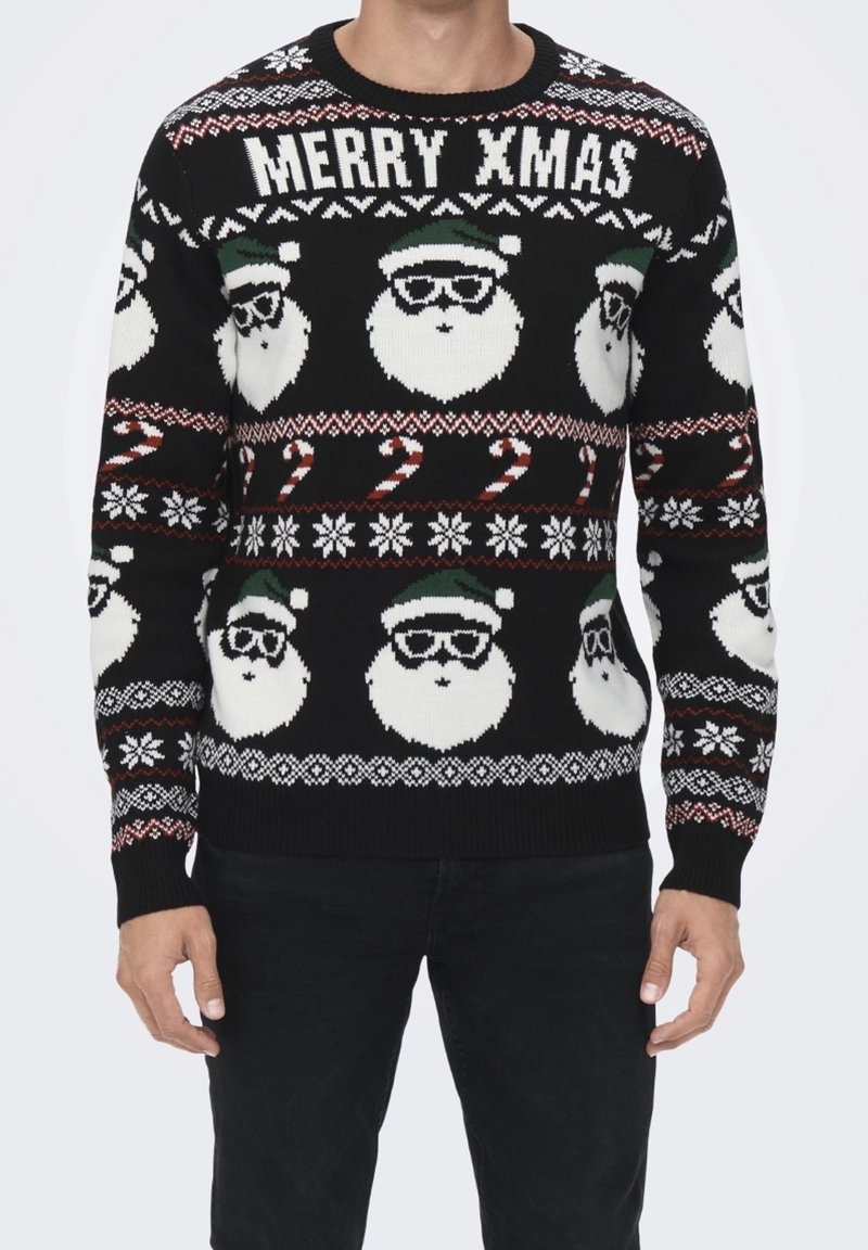 Maglione nero lavorato a maglia con un motivo di volti di Babbo Natale, bastoncini di zucchero e fiocchi di neve. Testo "MERRY XMAS" in bianco; dettagli verdi e rossi.