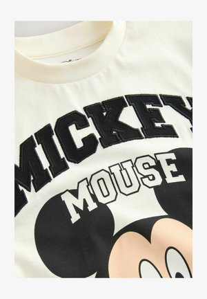 Kremowa koszulka z bawełny. Posiada wyrazisty czarny napis "MICKEY MOUSE" oraz grafikę przedstawiającą twarz Myszki Miki, o gładkiej fakturze.