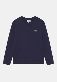 Felpa blu navy in cotone, con scollatura a V, maniche lunghe, polsini a costine e un logo a forma di coccodrillo ricamato in verde sul petto.