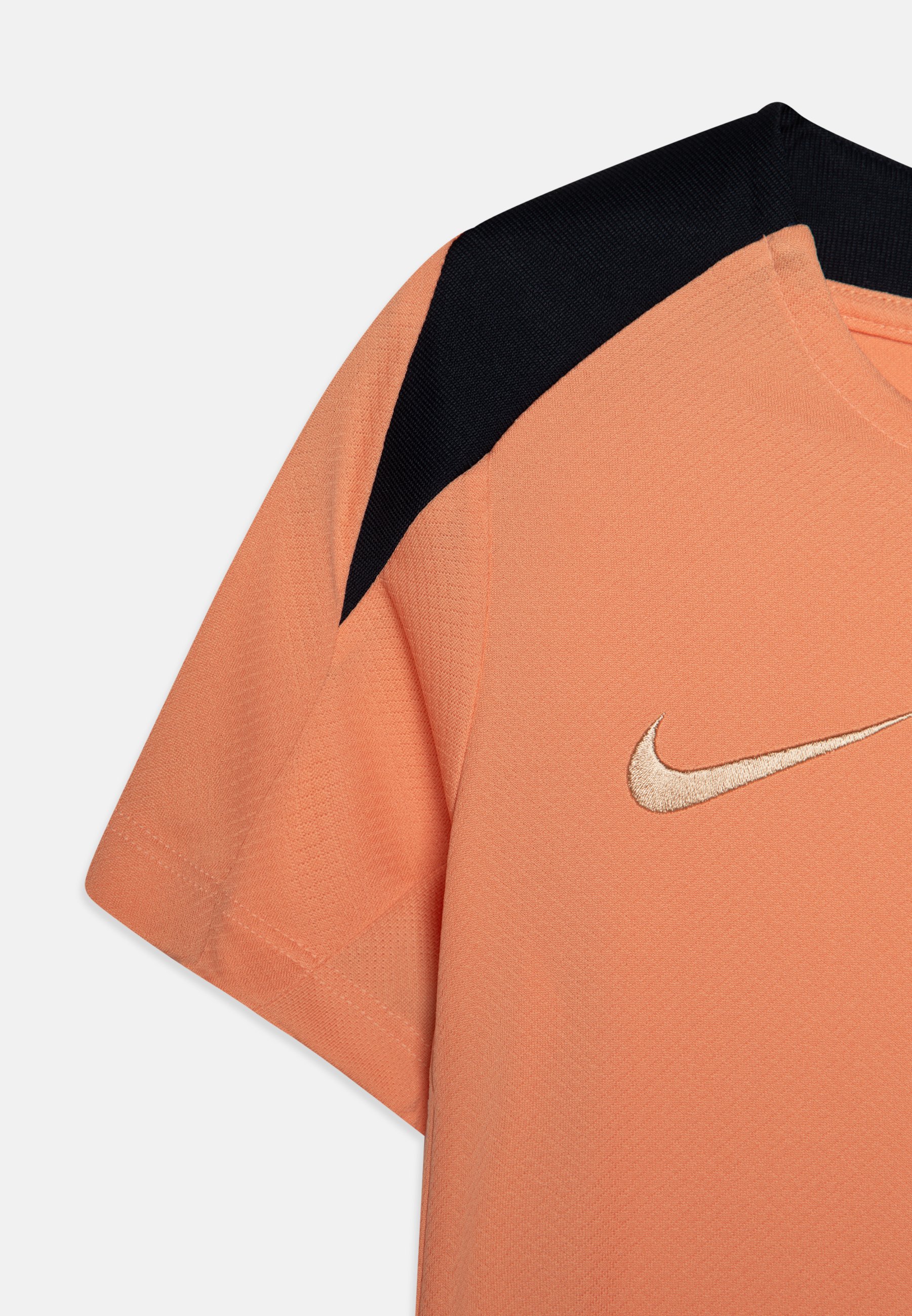 peach and black nike shirt