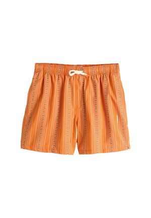 Pantaloncini da bagno arancioni con righe floreali verticali bianche e blu e una vita elasticizzata con coulisse bianca sul davanti.