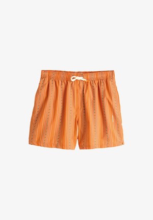 Pantaloncini da bagno arancioni con righe floreali verticali bianche e blu e una vita elasticizzata con coulisse bianca sul davanti.