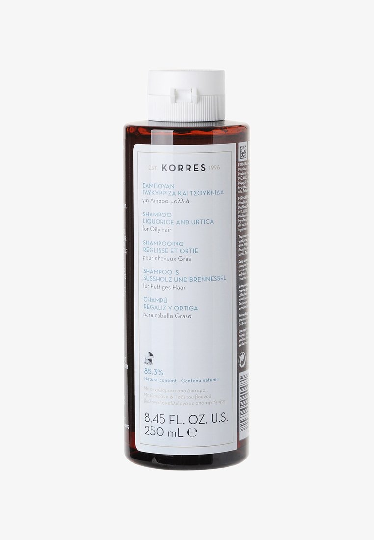 Transparente Flasche mit weißem Deckel; dunkle Bernsteinfarbe; das Produktetikett zeigt blaue und weiße Schrift; Inhalt: 250 ml Shampoo für fettiges Haar.