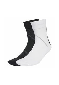 Black and white ankle socks made of a thin, textured material, featuring a contrasting grey pattern on the black sock and a smooth finish.