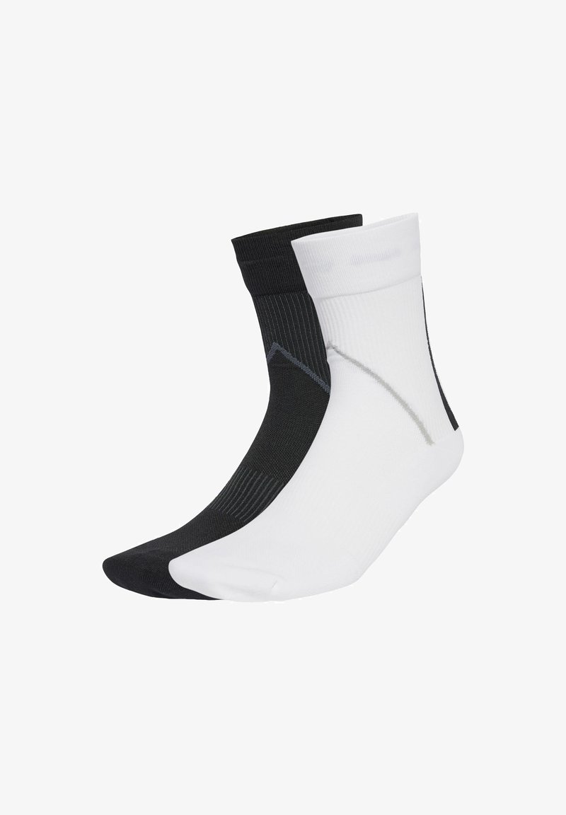 Black and white ankle socks made of a thin, textured material, featuring a contrasting grey pattern on the black sock and a smooth finish.
