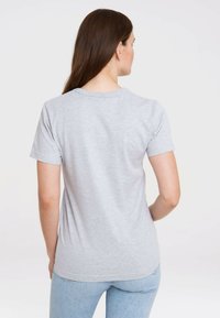 Light gray cotton t-shirt with short sleeves, crew neck, and a relaxed fit, featuring a smooth texture and no visible patterns or graphics.