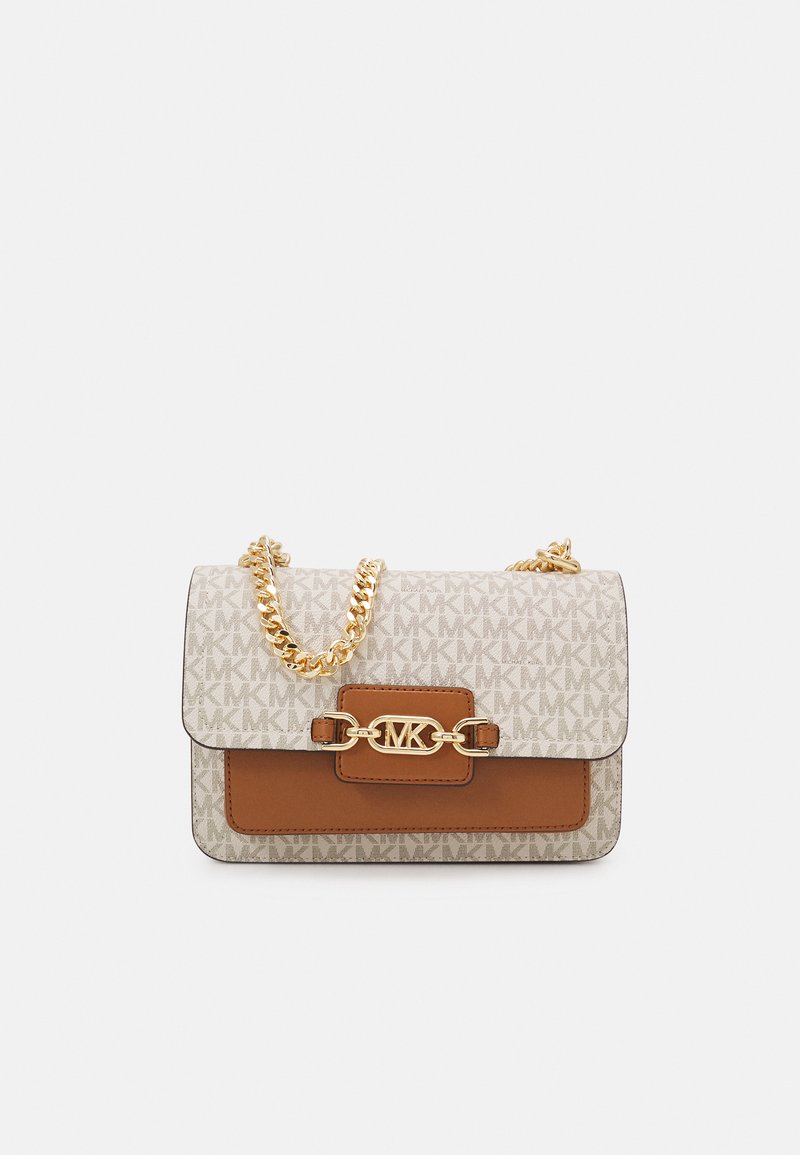 Tan and beige handbag with a gold chain strap, featuring a logo clasp and a monogram pattern on the front. Compact rectangular shape.
