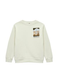 Jasnobeżowa bluza w miękkim materiale, z graficznym wzorem gór oraz napisem "W DRODZE" w pomarańczowym i czarnym kolorze. ściągacze przy mankietach i u dołu.