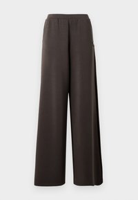 Dunkelbraune weit geschnittene Hosen mit einem elastischen Bund und Seitentaschen, auf einem weißen Hintergrund präsentiert.