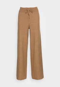 Brede broek in een zachte, tan gebreide stof. Heeft een geribde tailleband met een trekkoord, wat een verstelbare pasvorm biedt.