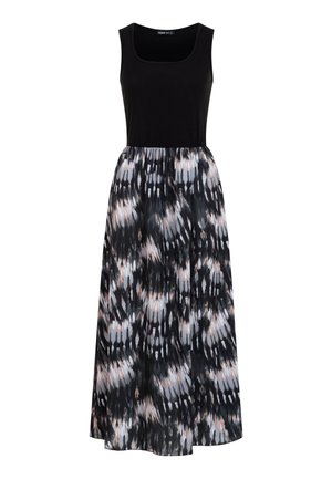 Mouwloze zwarte topjurk met een losse, patroonrok met zwarte, witte en licht perzik abstracte vlekken.