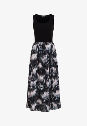 Mouwloze zwarte topjurk met een losse, patroonrok met zwarte, witte en licht perzik abstracte vlekken.
