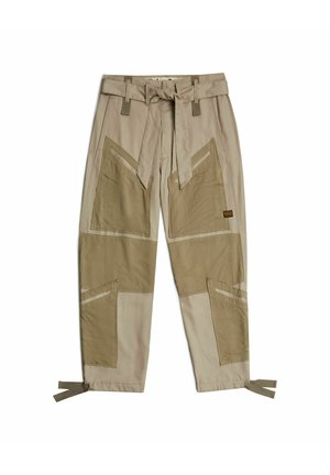Beige broek met een mix van textuuroverlays in donkere tinten, een gestrikte tailleband en verstelbare strikjes aan de zoom. Beschikt over hoekige zakontwerpen.